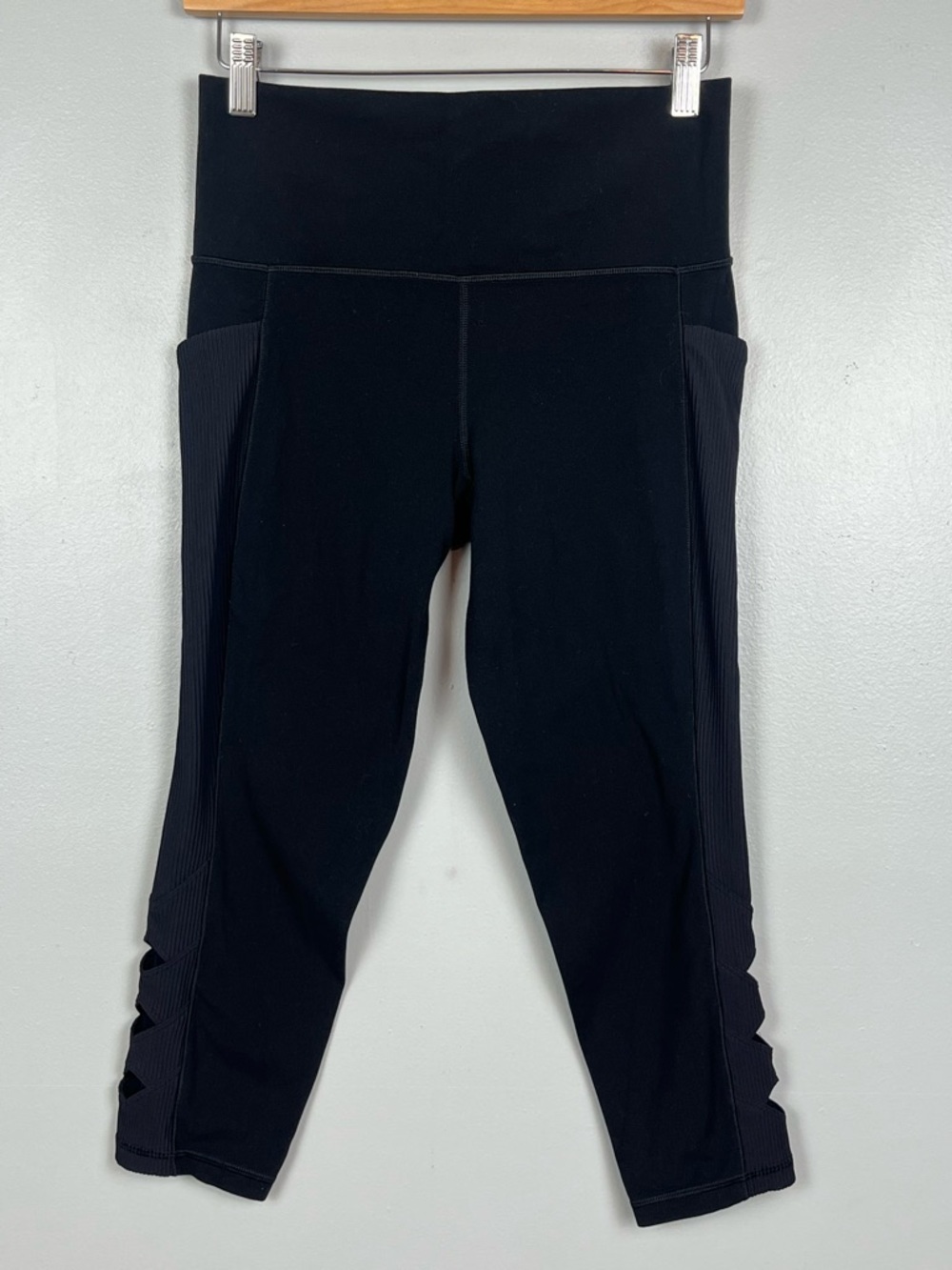 Athleta black Salutation Stash Pocket II Cutout 7/8 leggings, medium petite.